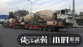 巨無霸來了！半掛車“背”著水泥車欲上高速！